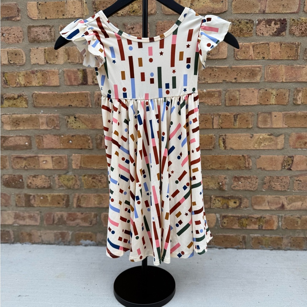 Dot Dot Smile Cream Dress with Colorful Geometric Pattern